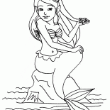 美人魚坐在一塊岩石上